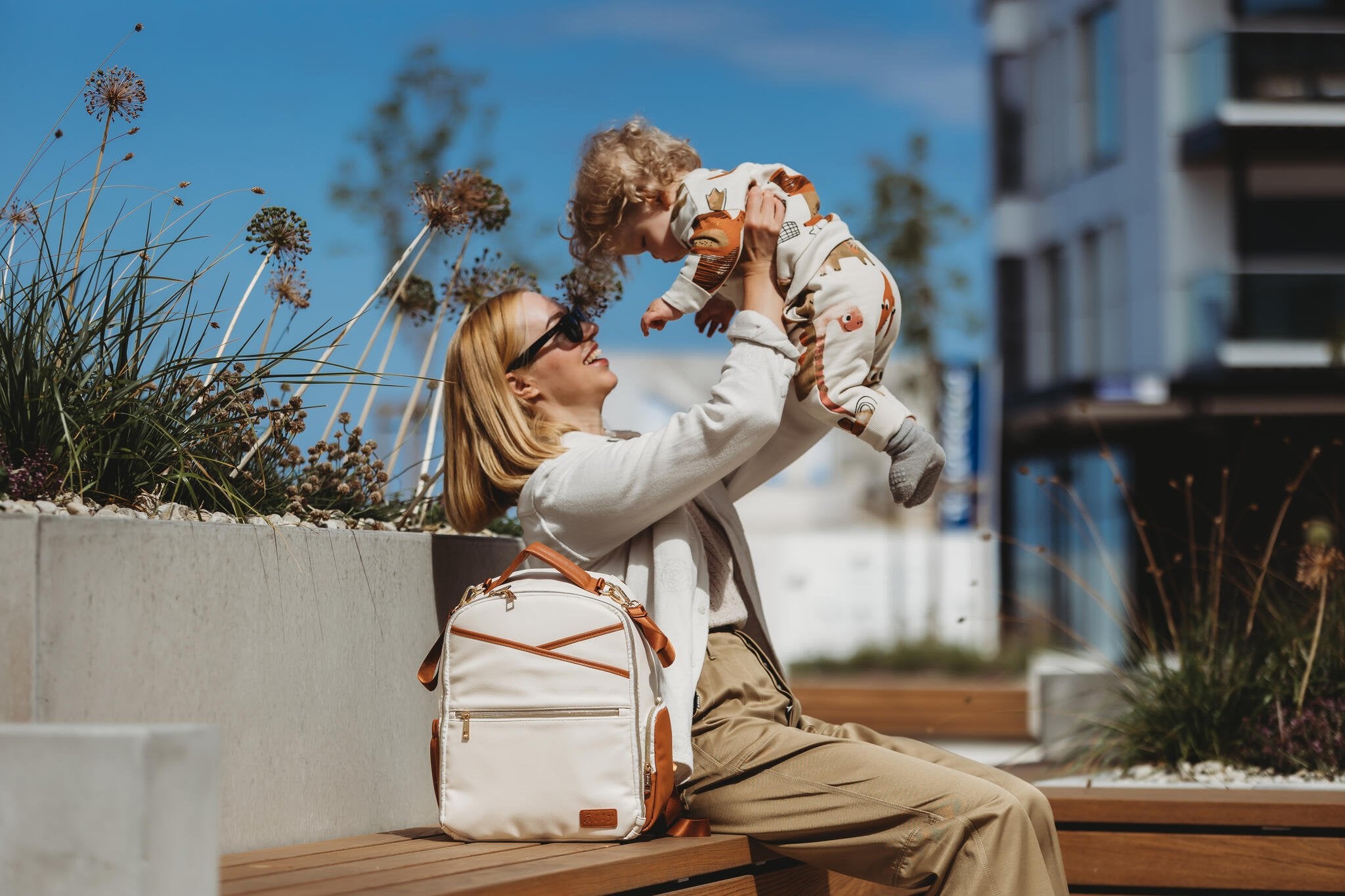 8. Studio image of two Ally Scandic small cappuccino diaper backpacks showing front and side views