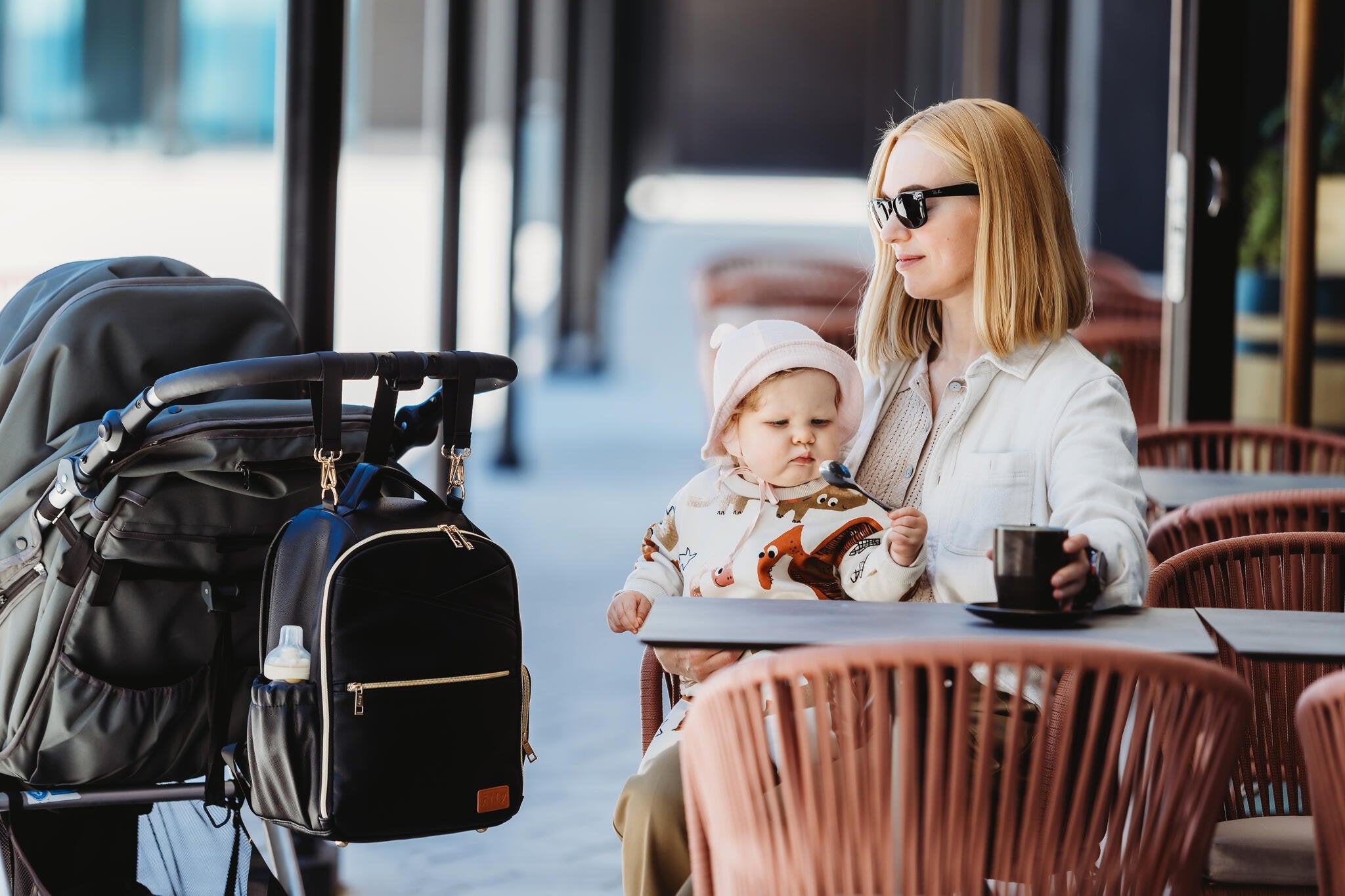 19. Pair of Ally Scandic Small Espresso Diaper Backpacks in studio setting