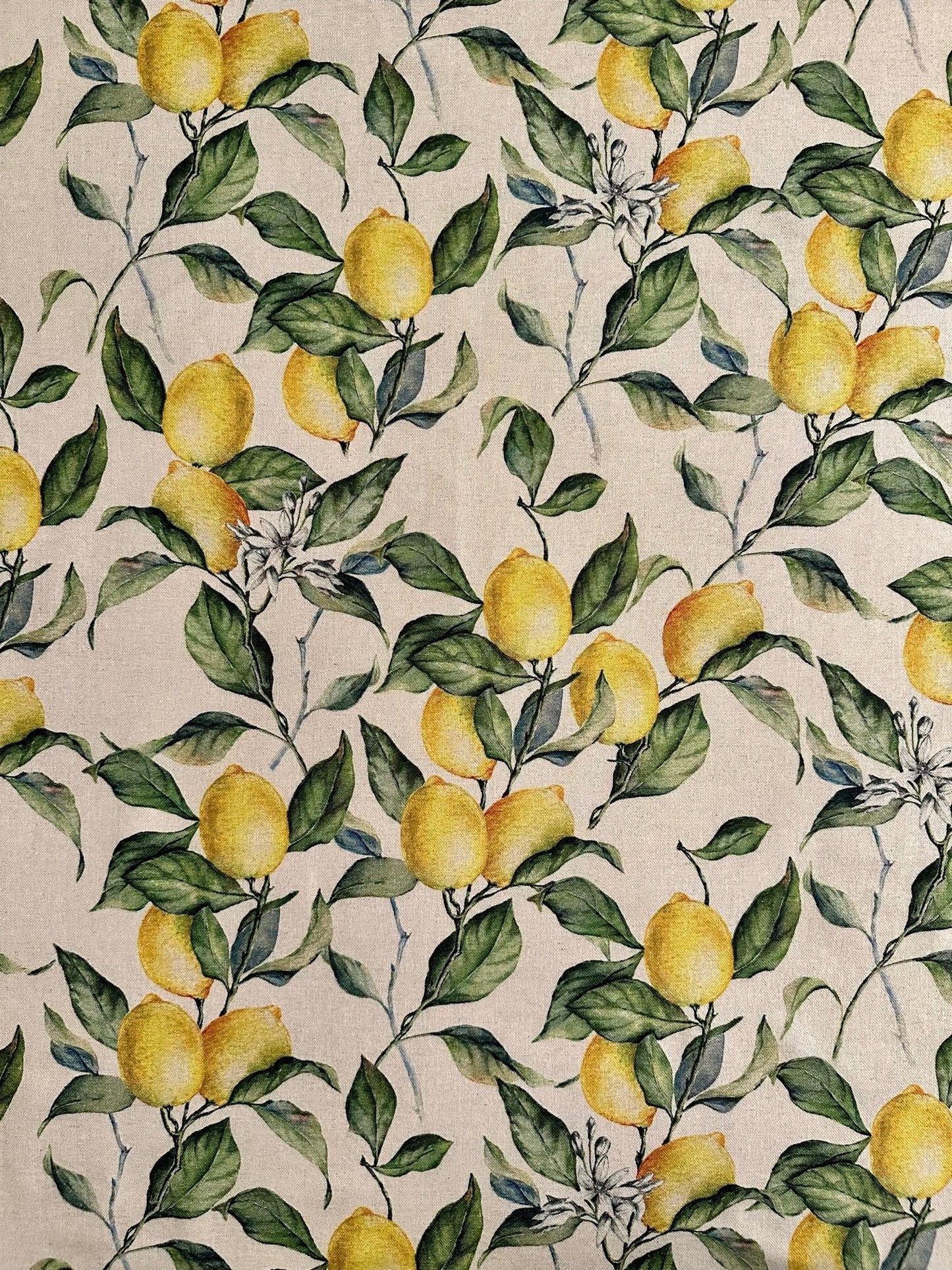 2. Close-up of lemon and green leaf print on beige cotton-linen fabric for Hortensias Home apron