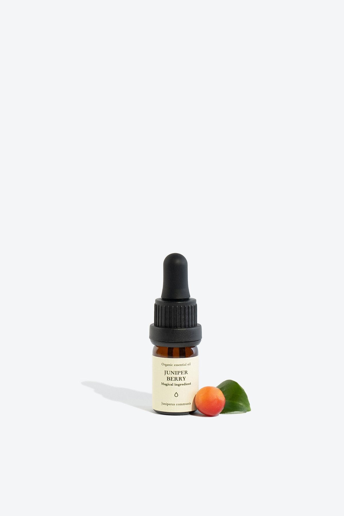3. Smells Like Spells JUNIPER BERRY essential oil with juniper berry and leaf, studio setting