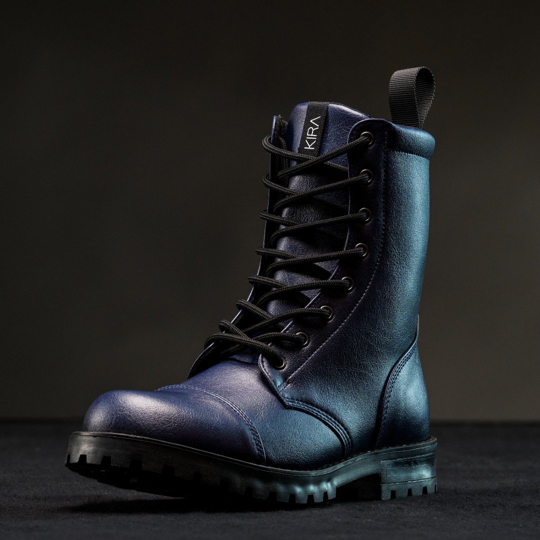 2. KIRA 6.0 sustainable blue boots with leather-like finish and deep tread sole, studio shot
