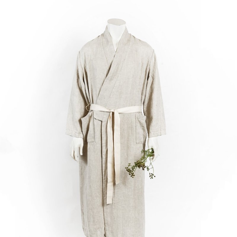 1. Mannequin wearing unisex grey linen bathrobe with cotton belt and pockets, holding a small branch, on a white background