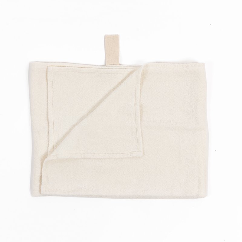 2. White linen towel with fishbone pattern laid flat, featuring natural band hanger, on a clean white background