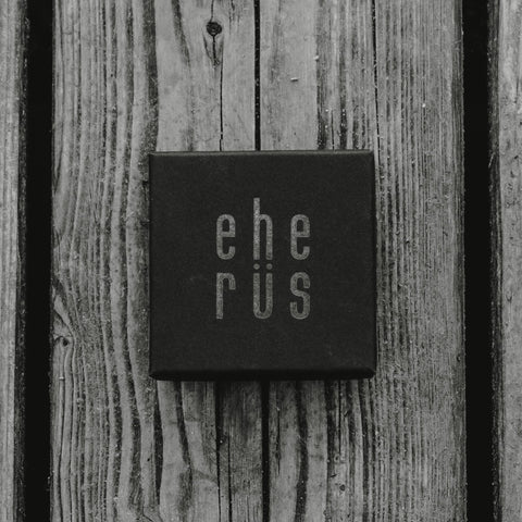 4. Eherüs branded gift box on wooden surface, packaging for round cufflinks