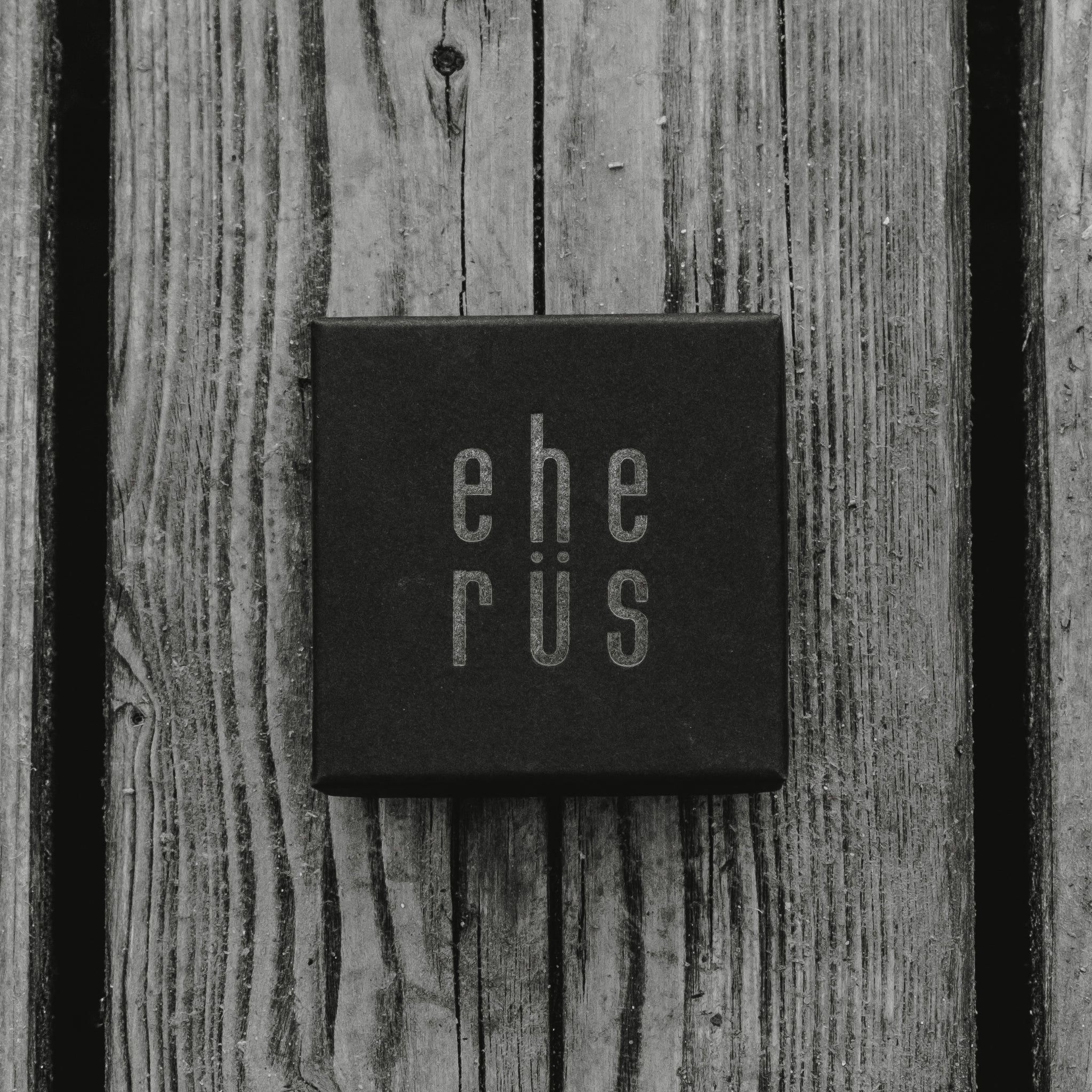 4. Eherüs branded black gift box on wooden surface