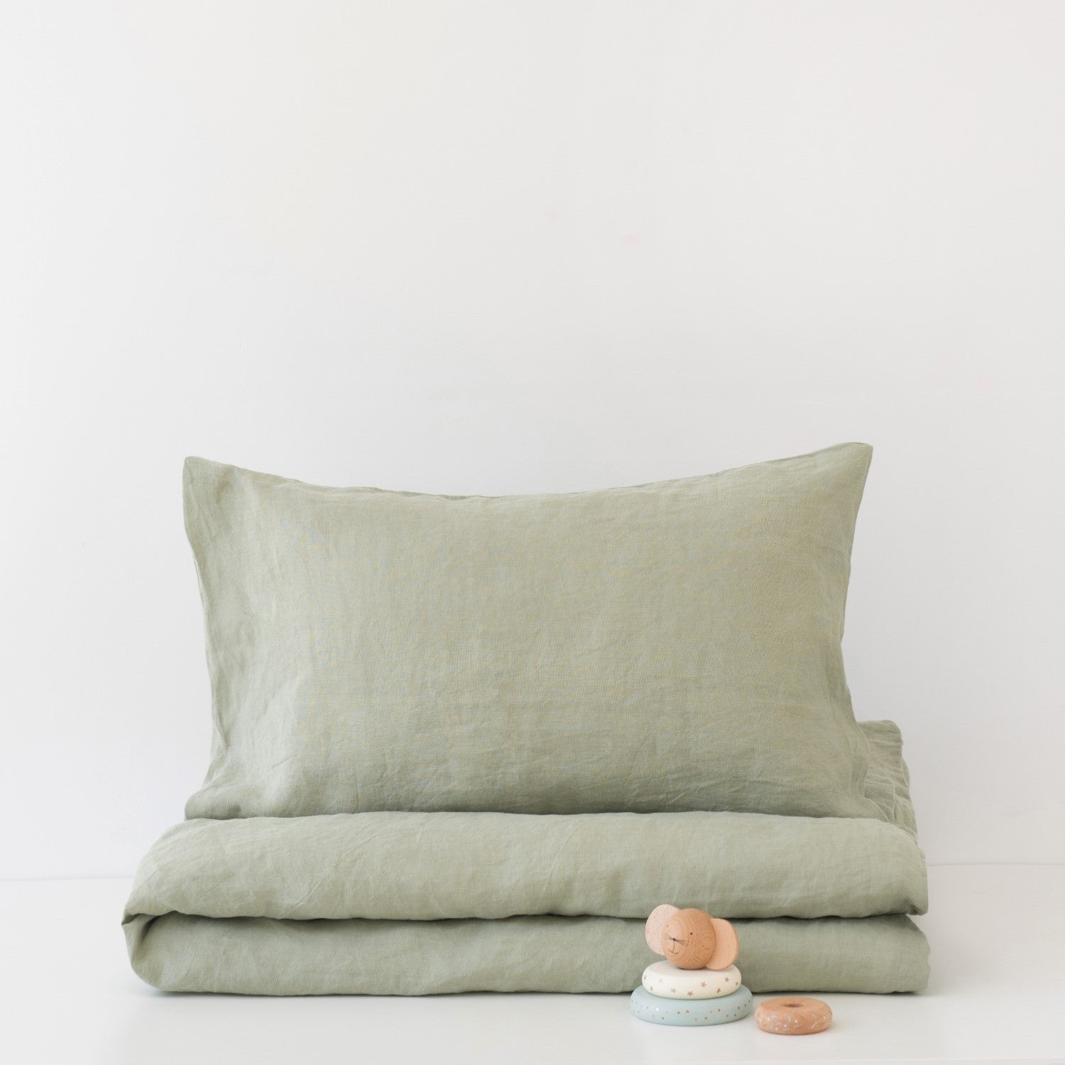 1. Sage green linen duvet cover set for kids with pillowcase, folded neatly on white background