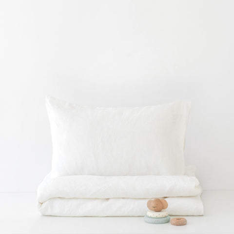 2. White linen duvet cover set for kids with pillowcase, folded neatly on a white background