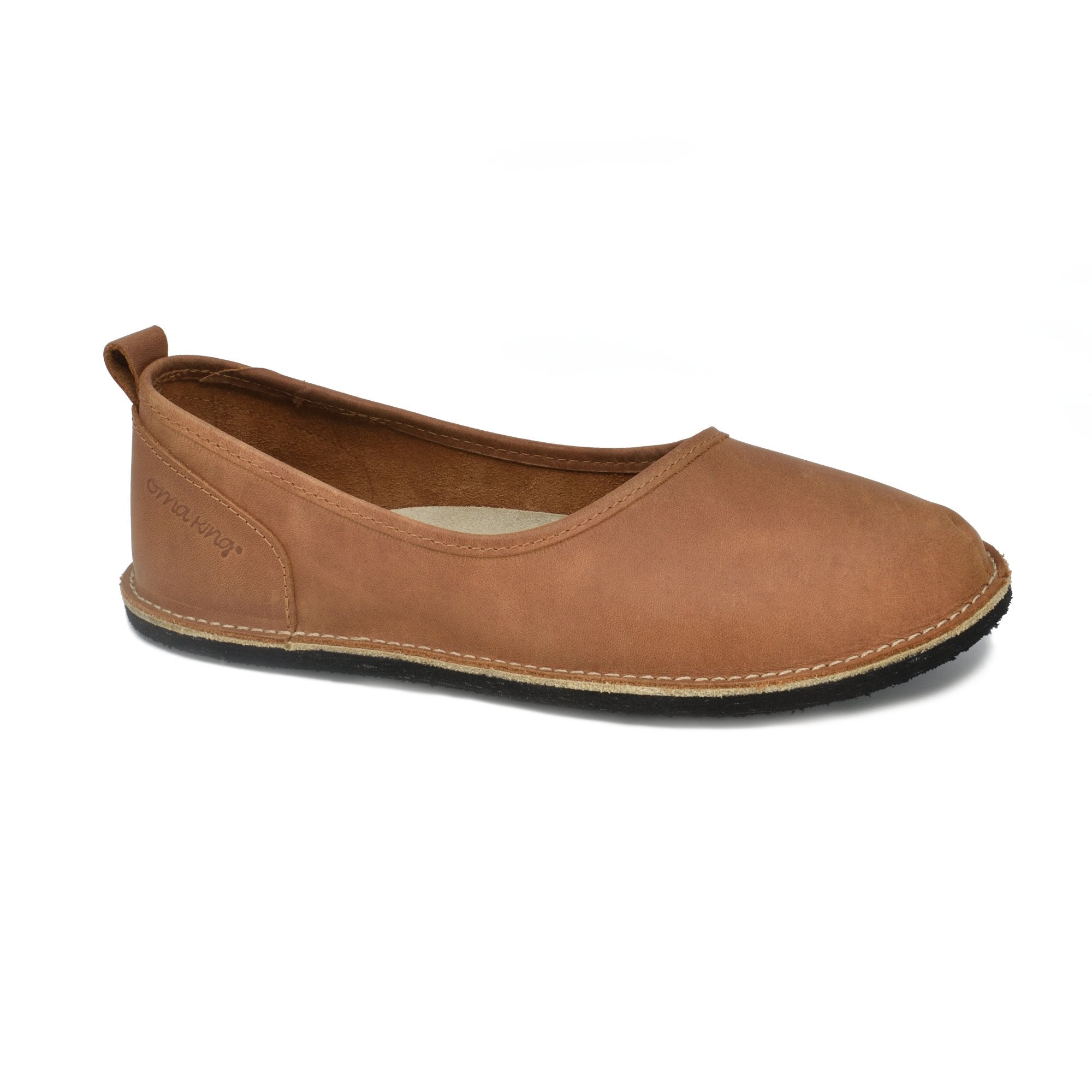 5. Side view of Omaking Kuutsid brown leather shoe showing brand logo and stitching