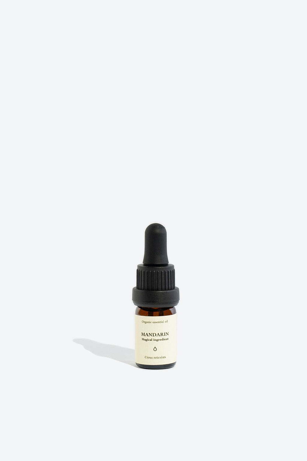 2. Smells Like Spells Mandarin essential oil in 5 ml glass bottle with pipette, studio setting