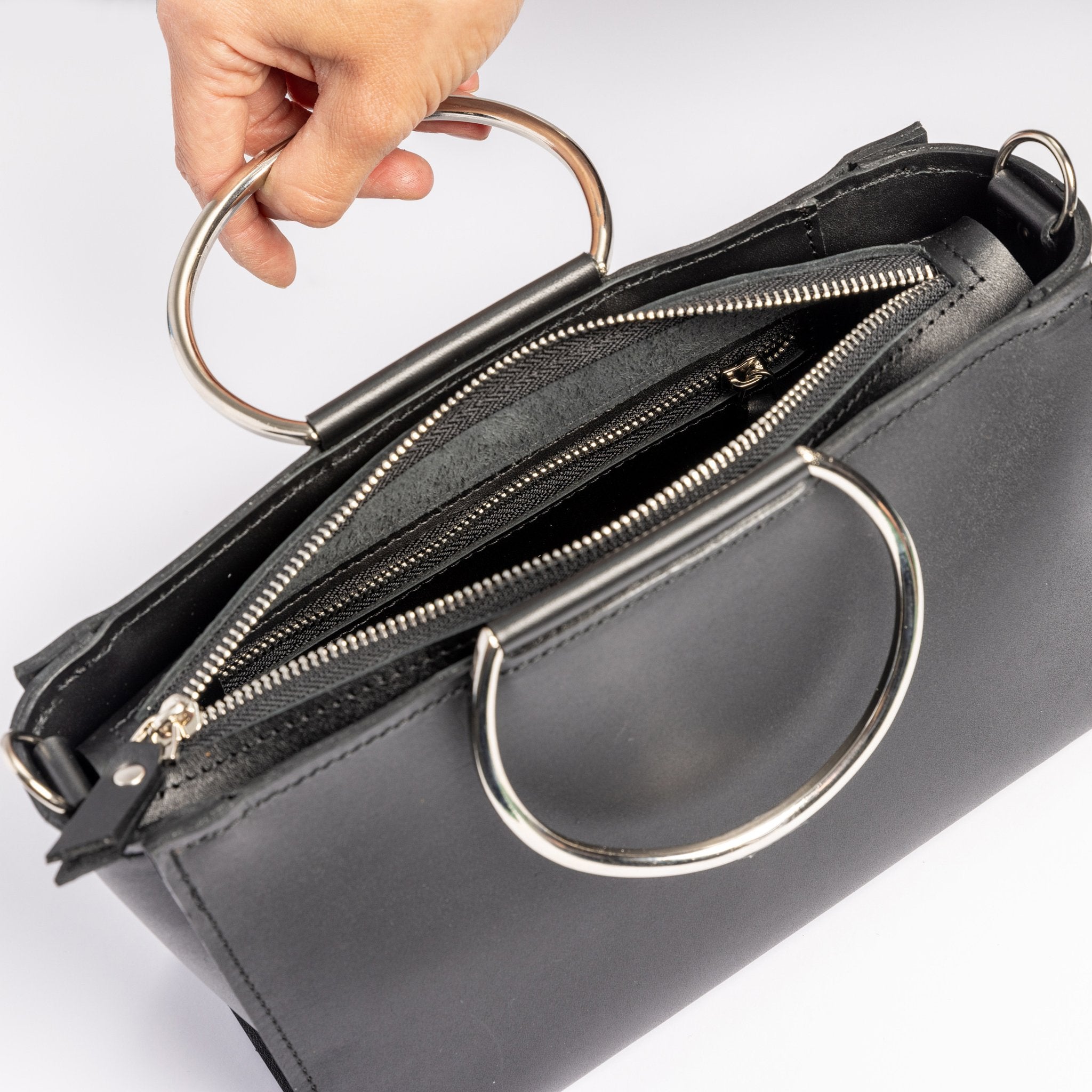 3. Top view of PYKOK Handbag Maria Mini showing zipper closure and metal handles