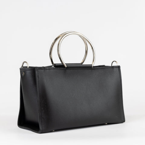 2. Black leather Handbag Maria Mini by PYKOK with metal handles, studio shot
