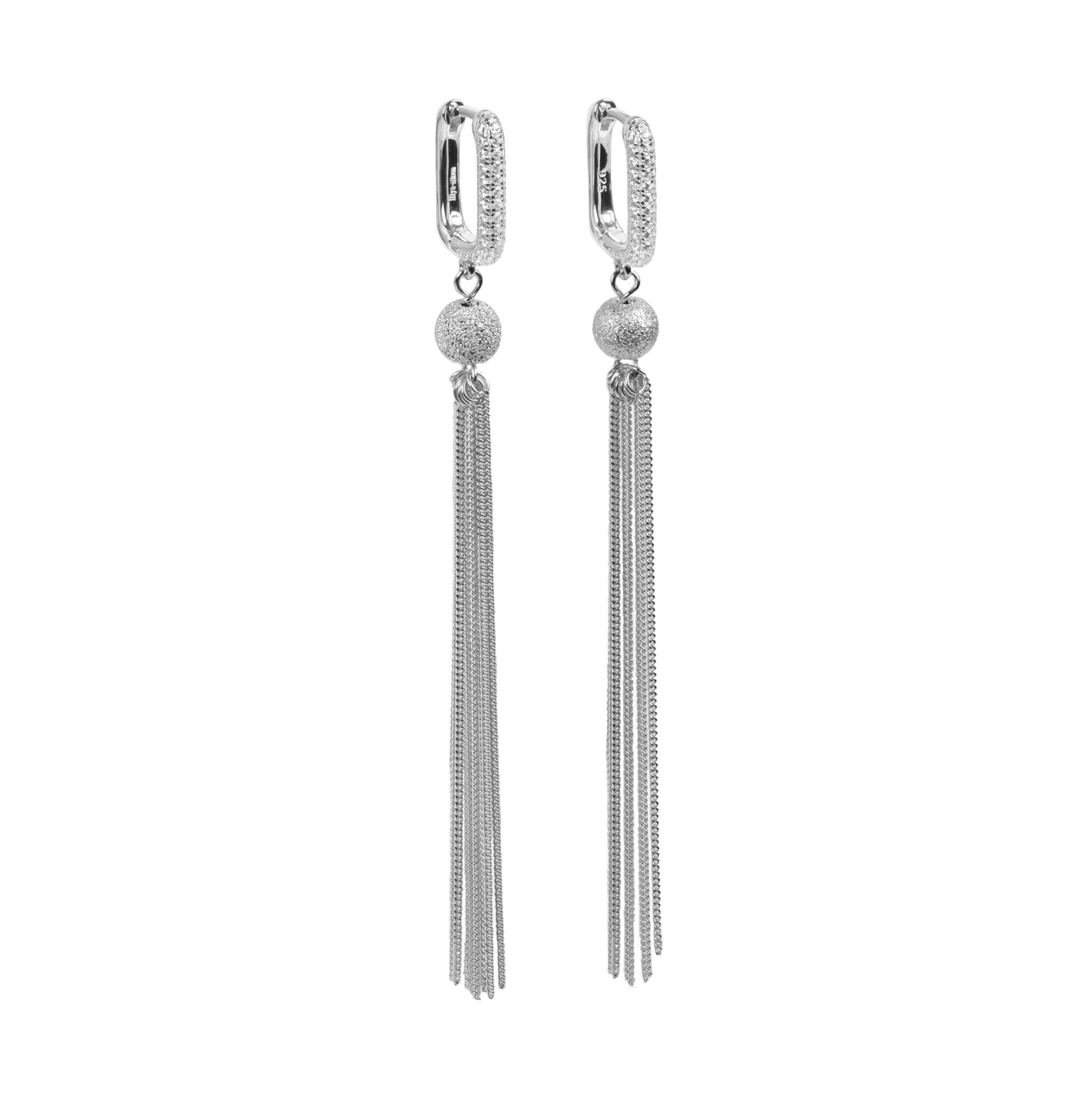 1. MyaMoon Metropolitan Glow white tassel earrings in silver plating with sparkling stones and chain fringes, studio shot