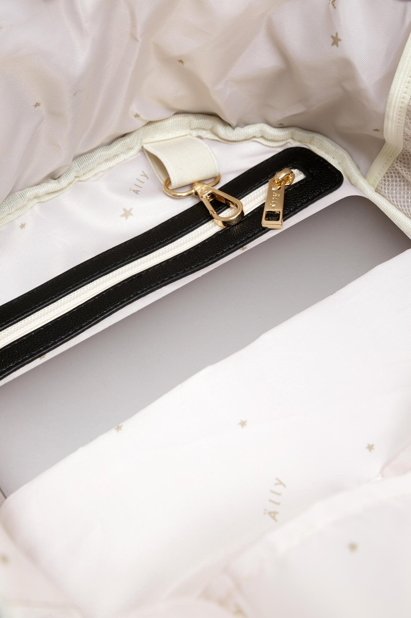 17. Close-up of interior pocket in Ally Scandic Espresso Diaper Backpack, highlighting laptop compartment