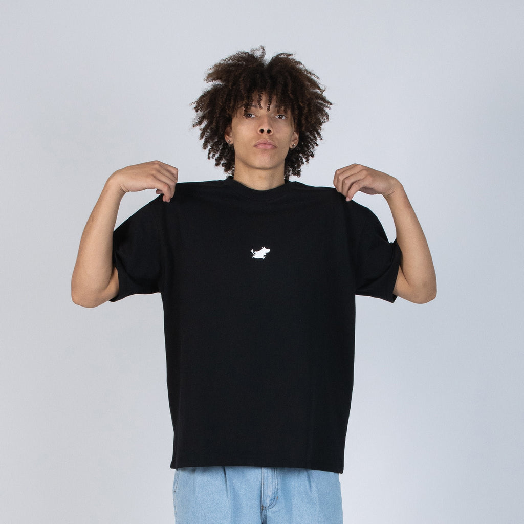 6. Male model wearing black Moomin Classics heavy t-shirt in studio setting