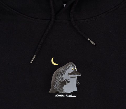 4. Close-up of Moomin character detail on black hoodie, featuring moon and Groke design
