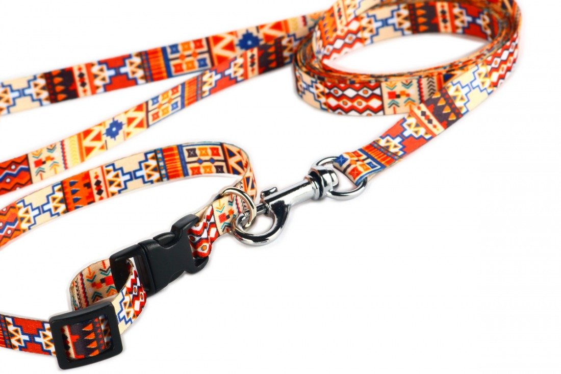 3. Close-up of boho dog leash with plastic buckle and metal carabiner, featuring vibrant geometric patterns
