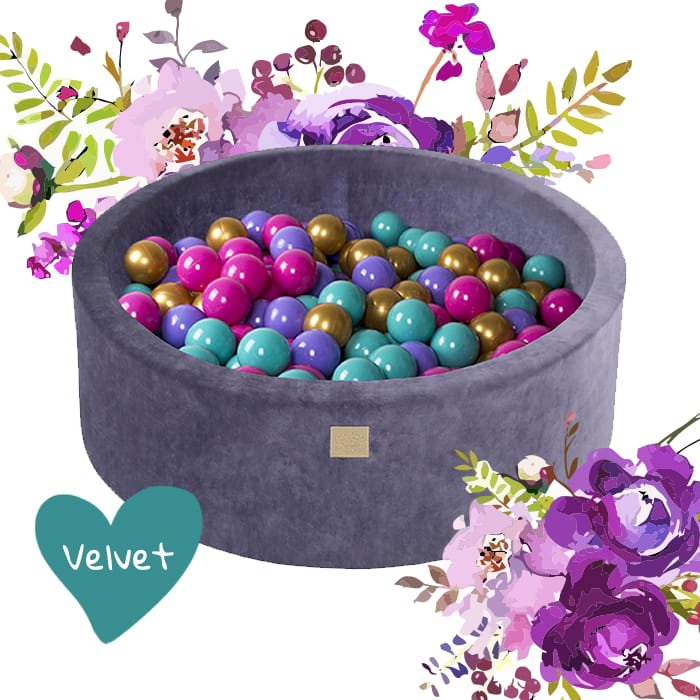6. Blue velvet MeowBaby ball pit with colorful balls and floral design elements