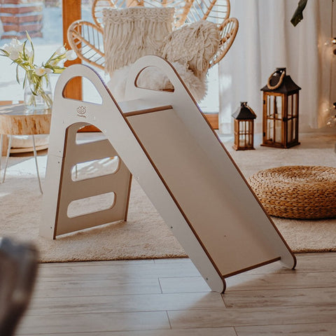 1. Wooden indoor slide for children in a cozy living room setting with natural light and wicker decor