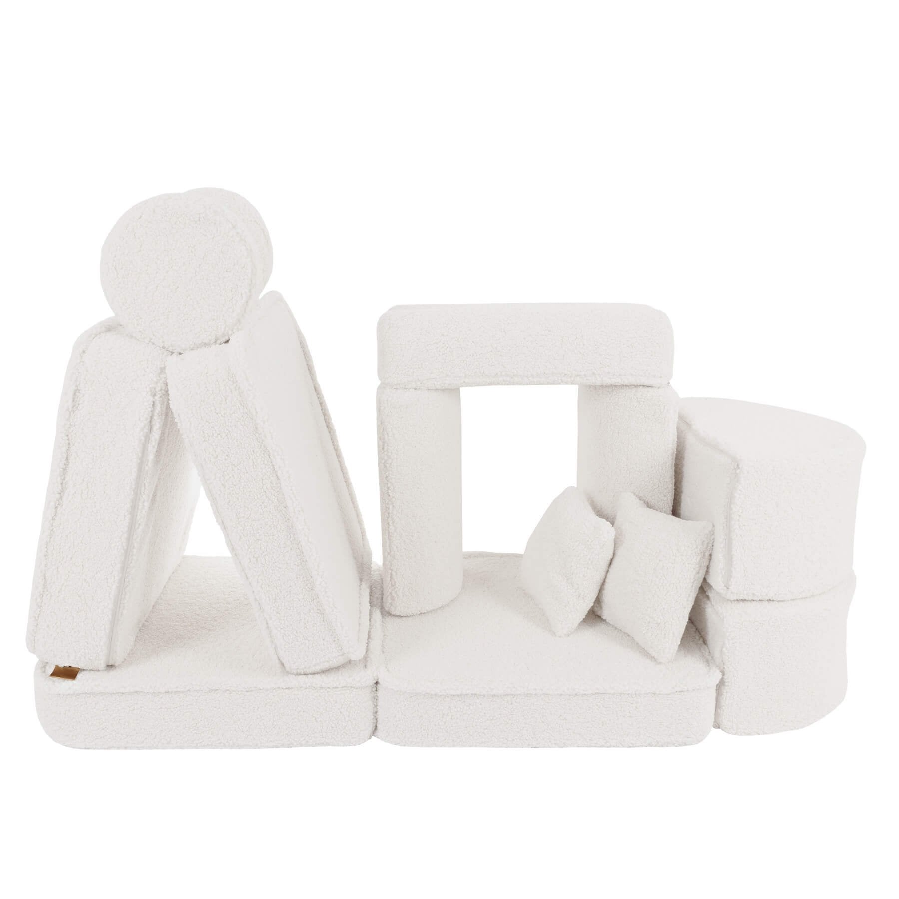 6. Modular children's sofa in bearly cream color with cushions arranged to form a play structure