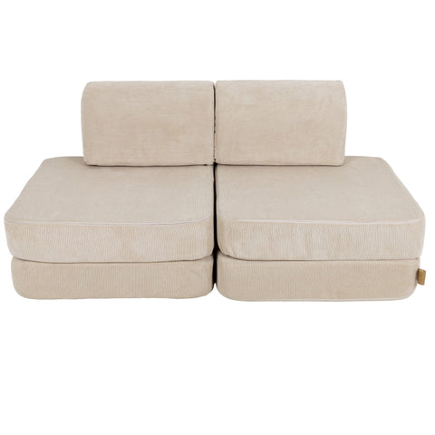 1. Small modular children's sofa in ecru Slimcord fabric with two back cushions and two seat cushions, shown in a studio setting