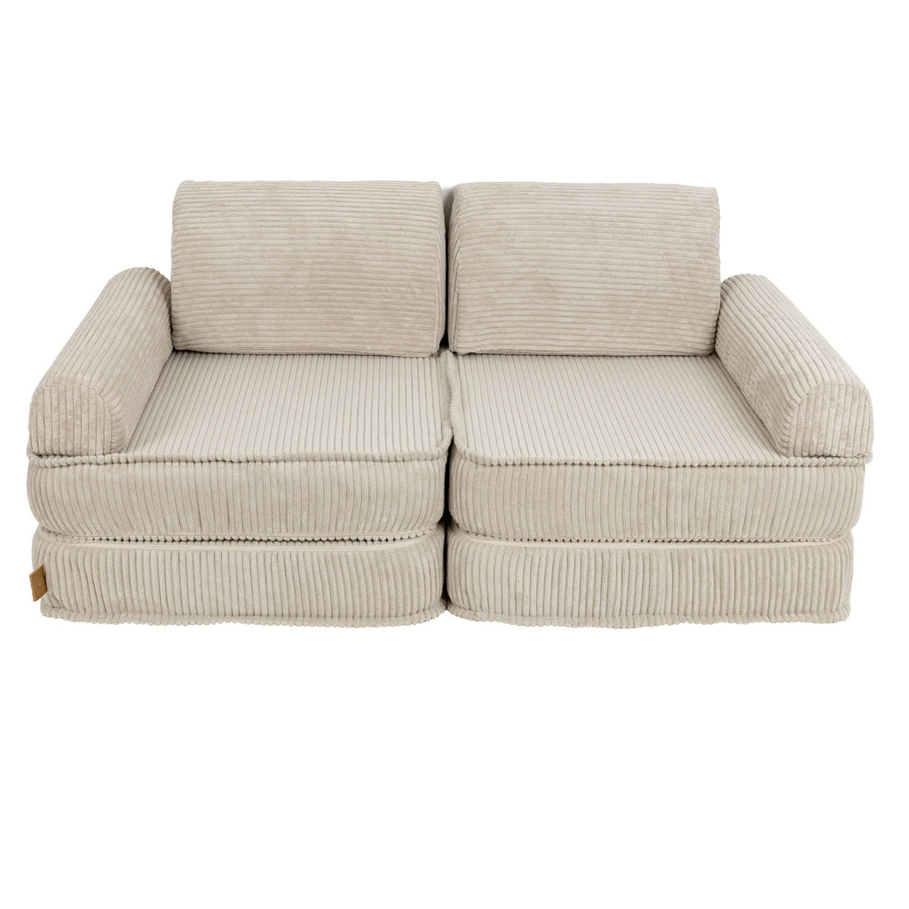 2. Children's modular sofa in aesthetic ecru with ribbed texture, featuring two back cushions, in a studio setting