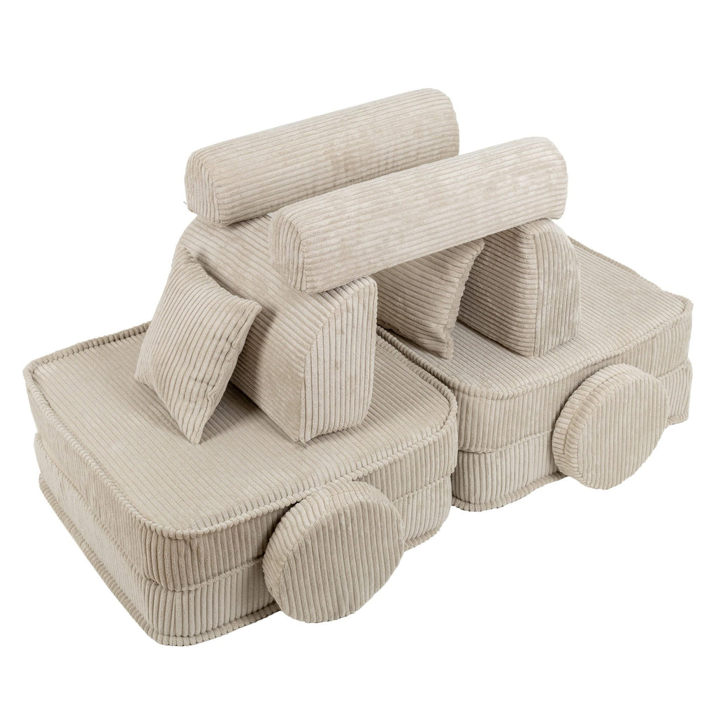 3. Creative arrangement of children's modular sofa in aesthetic ecru, forming a playful structure with ribbed texture, in a studio setting