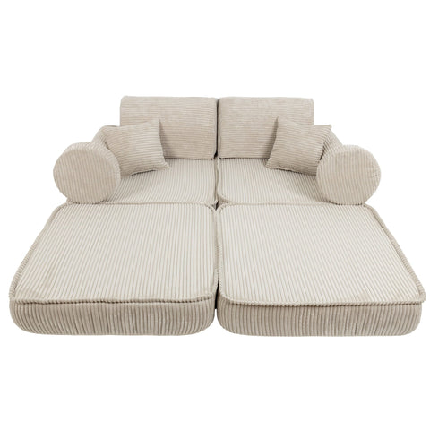 2. Children's modular sofa in aesthetic ecru with ribbed texture, fully extended to show flat lounging position, in a studio setting