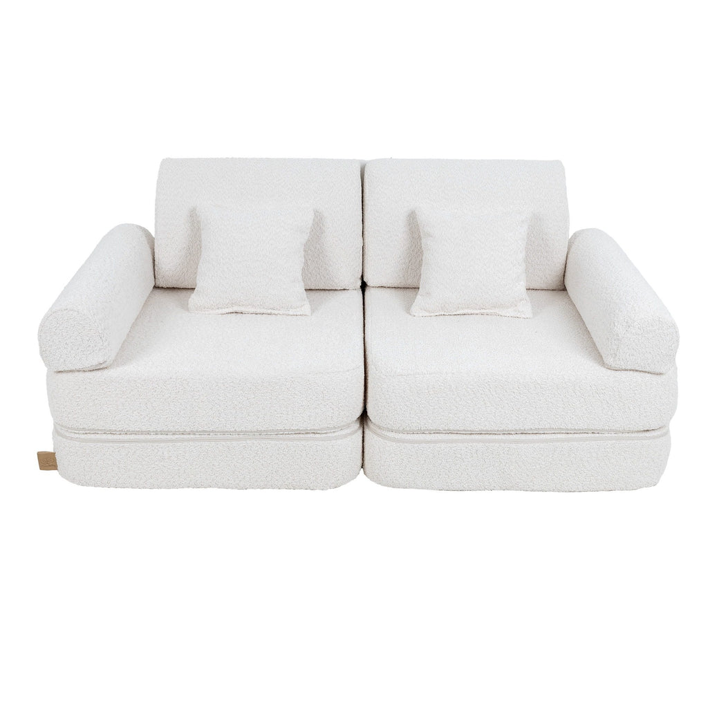 2. Medium modular children's sofa in white boucle fabric with two square cushions, shown in a studio setting