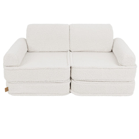 2. Medium modular sofa for kids in bearly cream without cushions, shown in a studio setting.