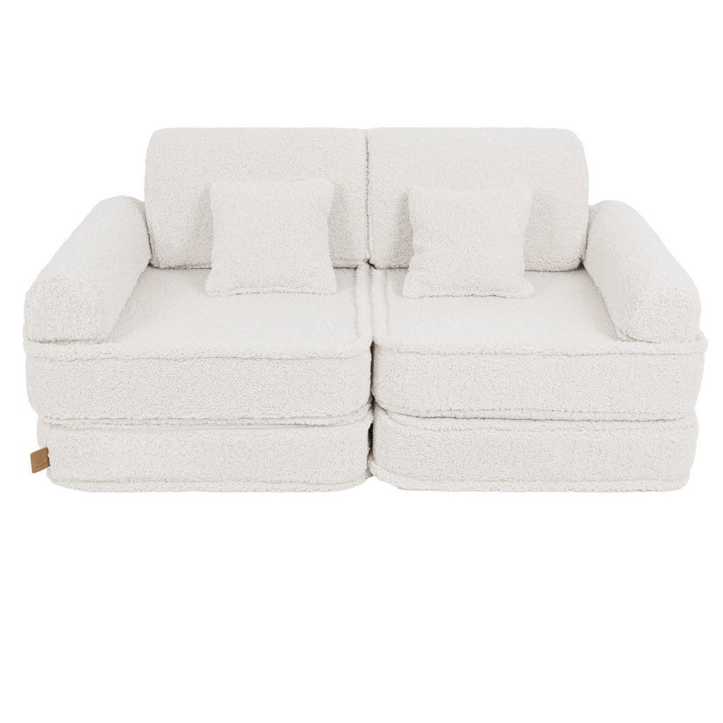 2. Medium modular sofa for kids in bearly cream with two square cushions, shown in a studio setting.