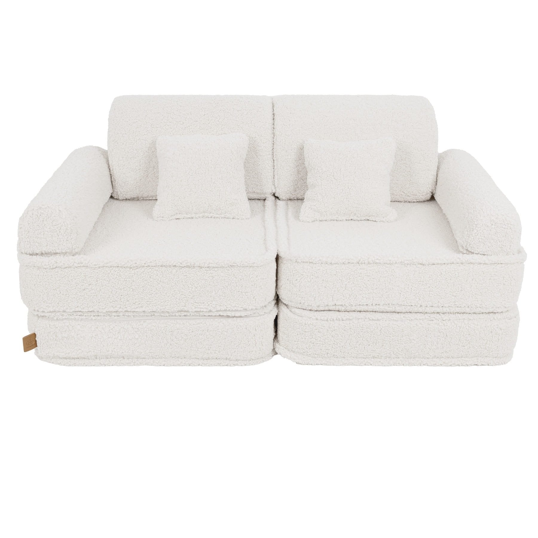 2. Medium modular sofa for kids in bearly cream with two square cushions, shown in a studio setting.