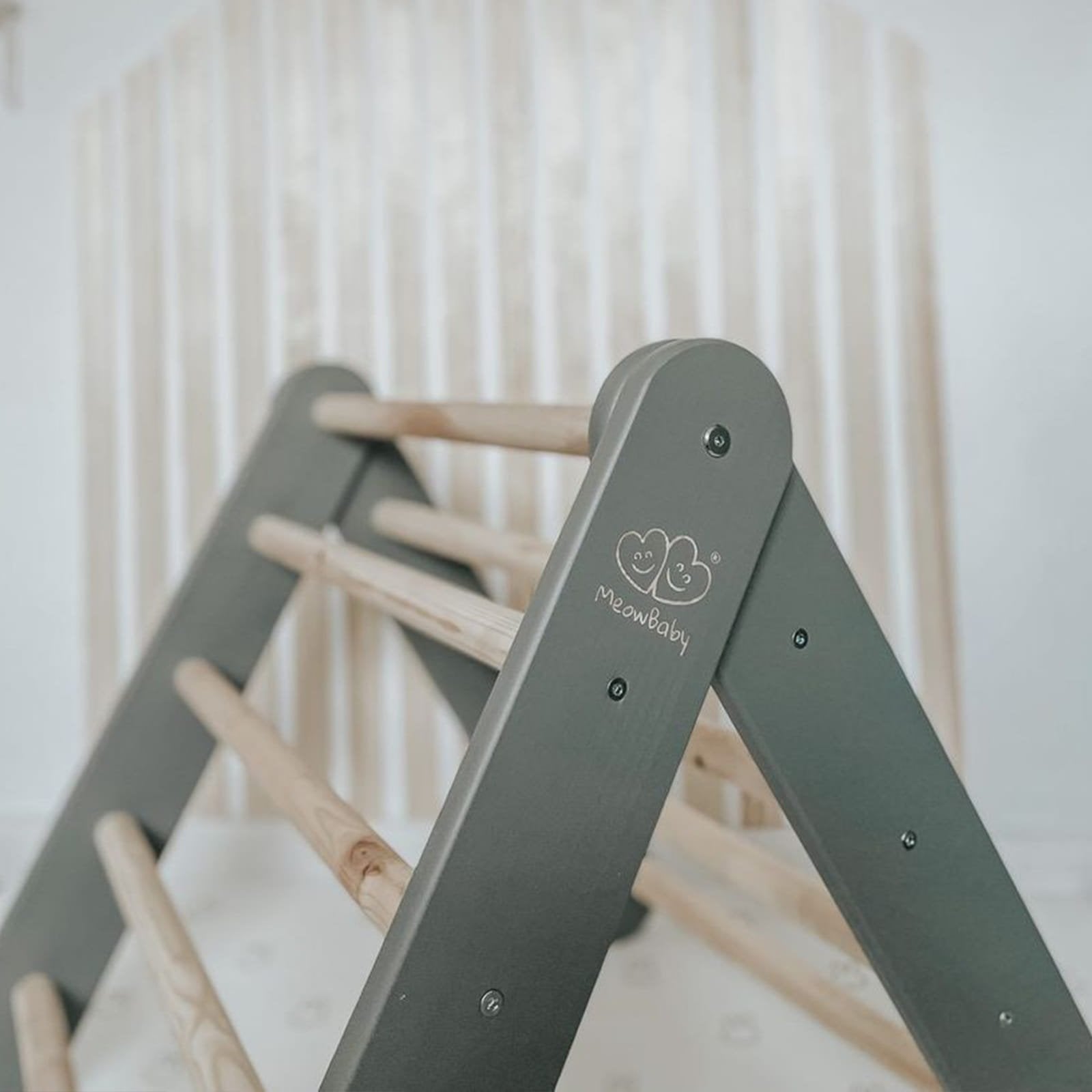 12. Grey ladder house with natural wood rungs in a nursery setting with MeowBaby logo visible
