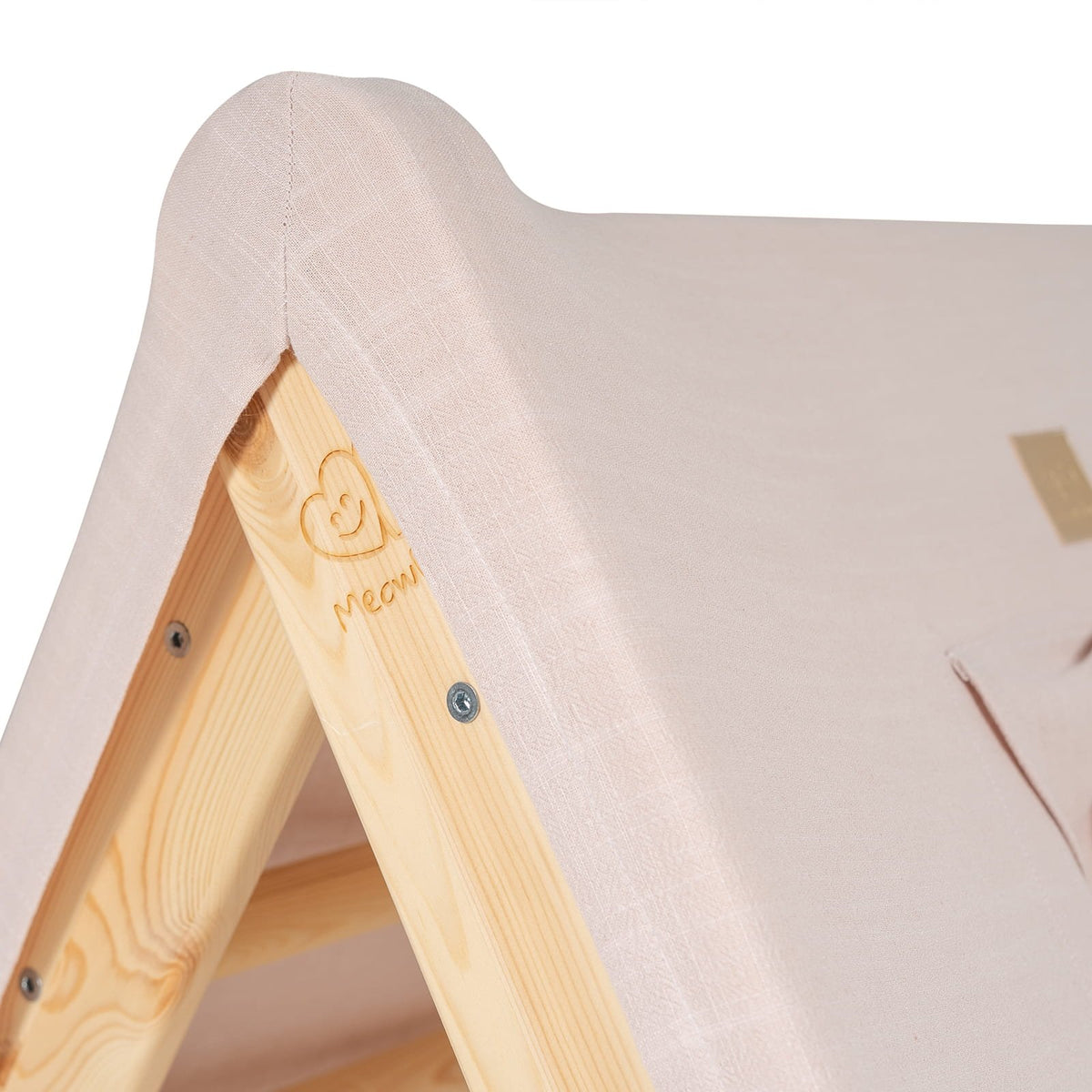 8. Detail of pink fabric cover and wooden frame on children's playhouse
