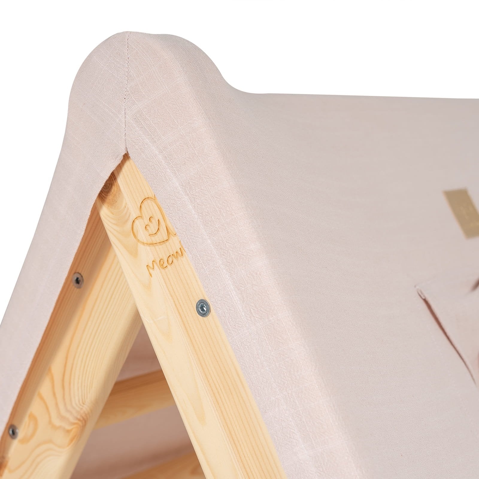 8. Detail of pink fabric cover and wooden frame on children's playhouse
