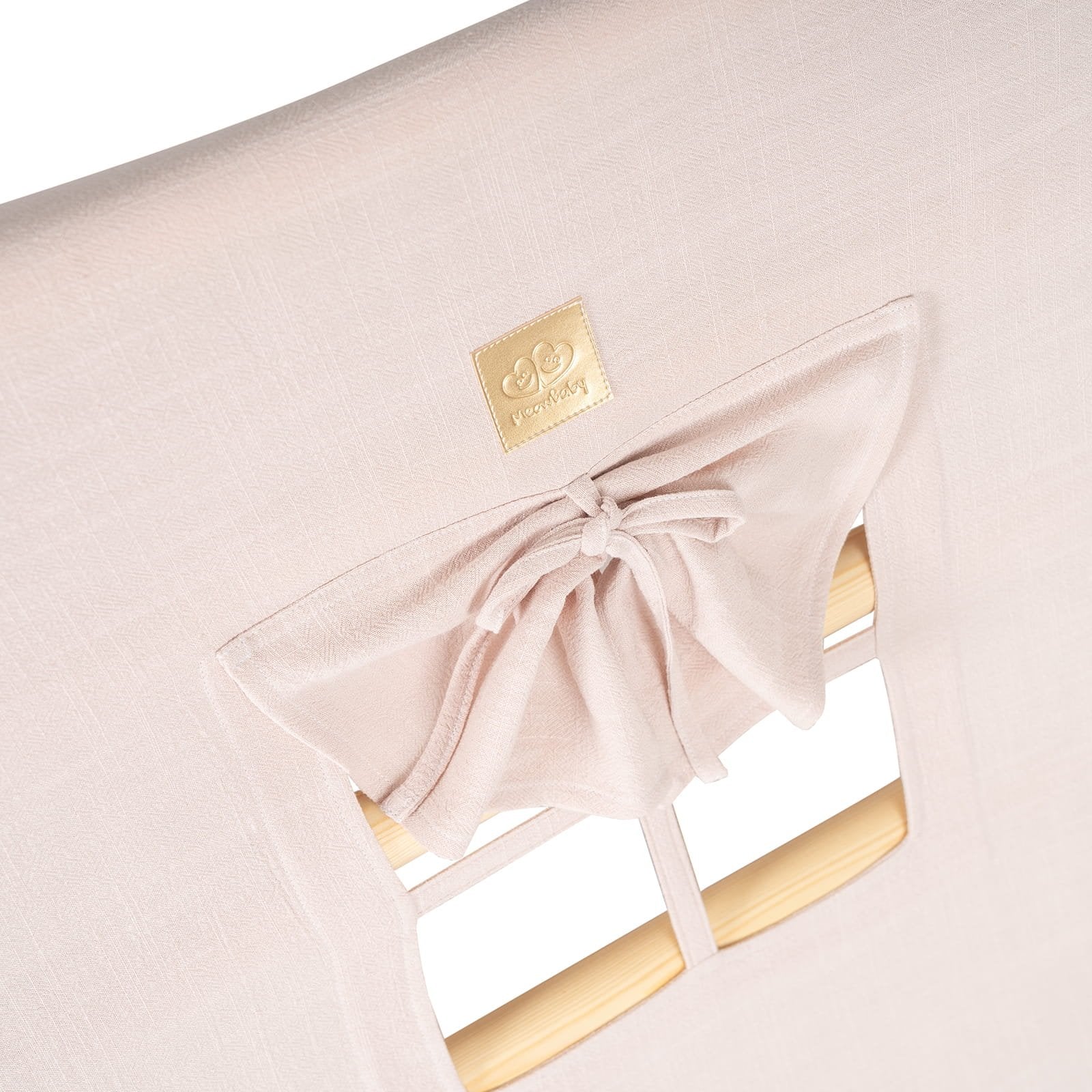 13. Close-up of pink cover with window and bow detail on ladder house
