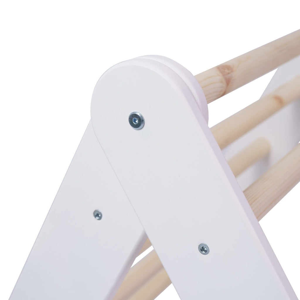 9. Close-up of white ladder house construction with natural wood rungs