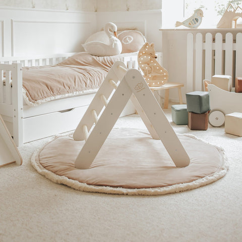 2. White ladder house in a cozy children's room with plush toys and soft lighting