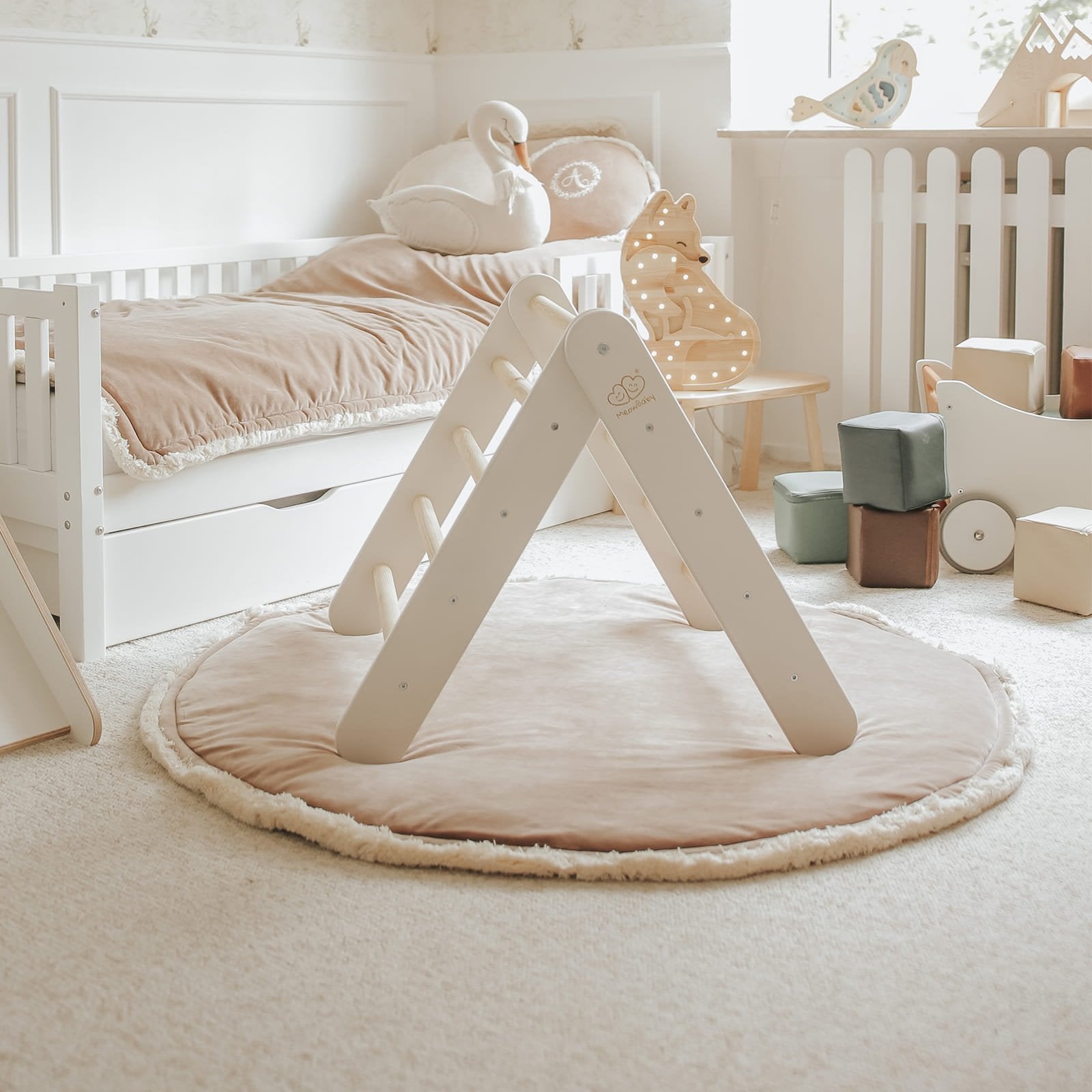6. White ladder house in children's room with plush decor and natural light