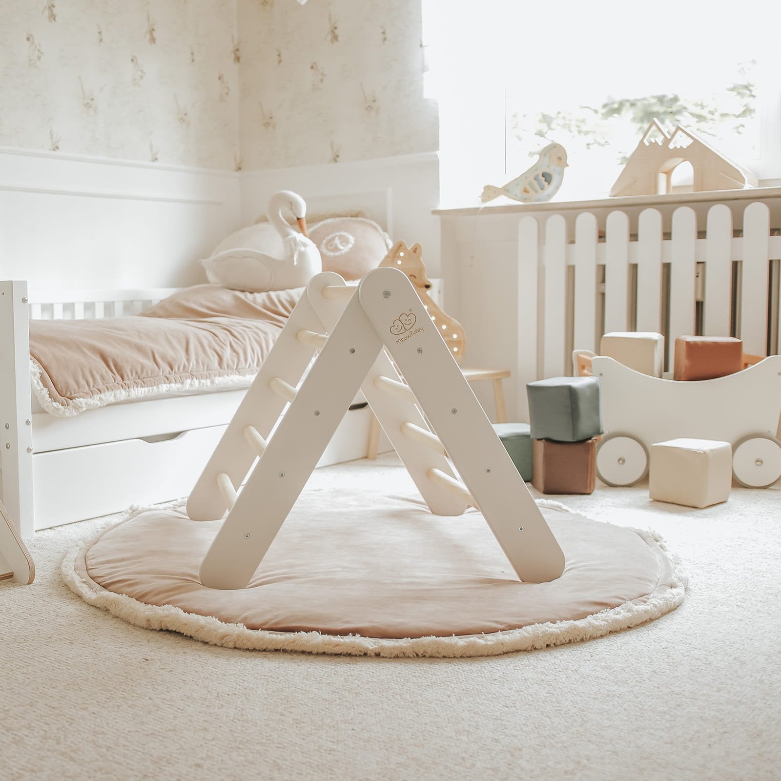 2. White ladder house in children's room with soft lighting and plush decor