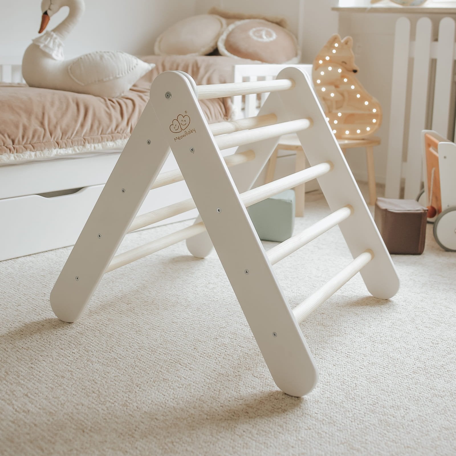 4. White ladder house in cozy children's room with plush toys and soft lighting