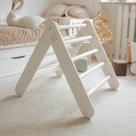 4. White ladder house in cozy children's room with plush toys and soft lighting