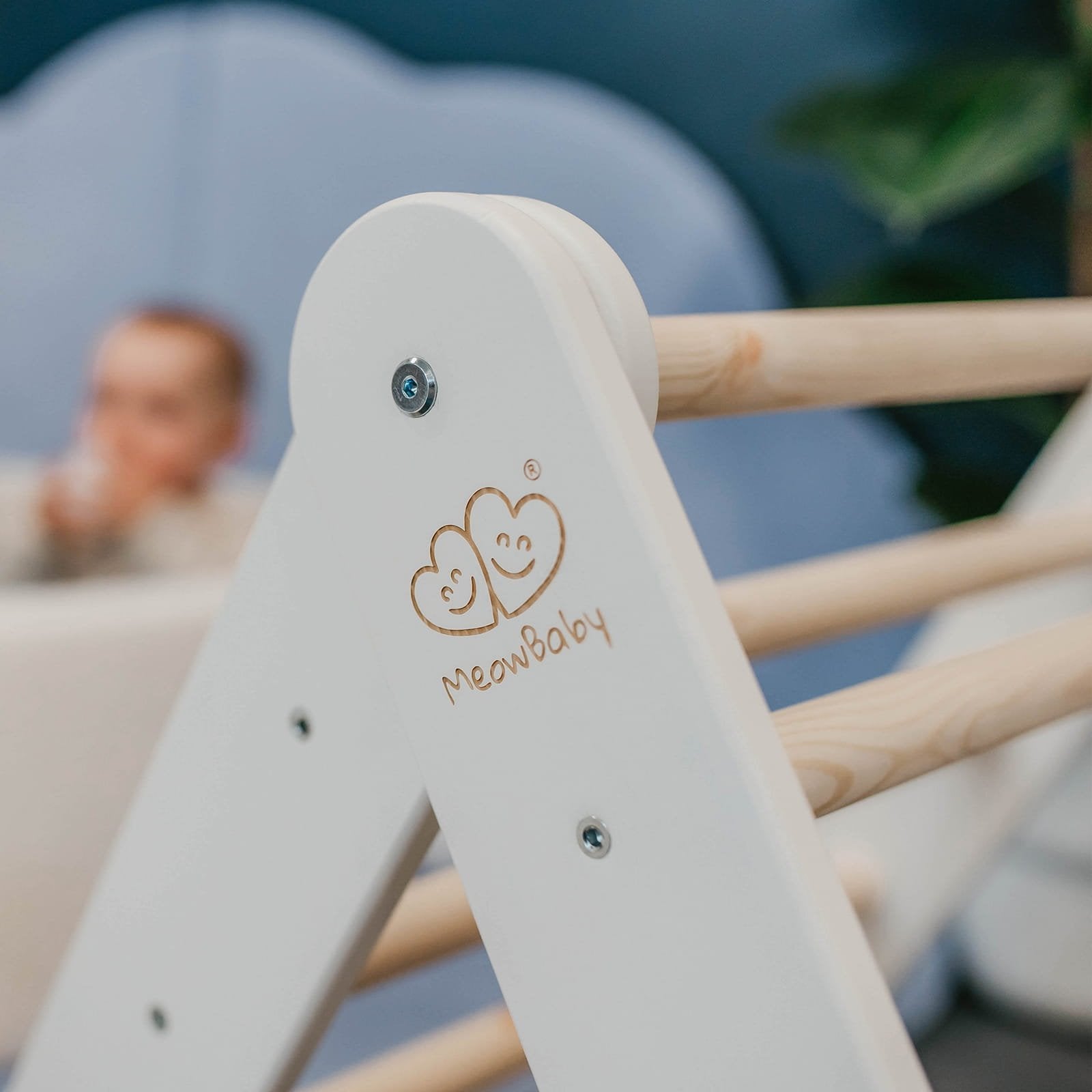 3. Close-up of MeowBaby logo on white ladder house with natural wood rungs