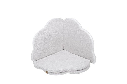 2. Cloud-shaped play mat in bearly white color, folded in a corner position with a textured surface, on a black background
