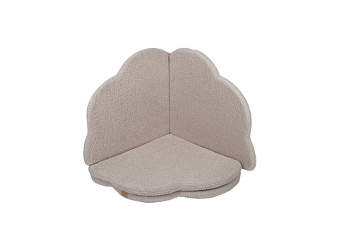 2. Light grey cloud-shaped play mat folded to form a corner seat, highlighting its versatility