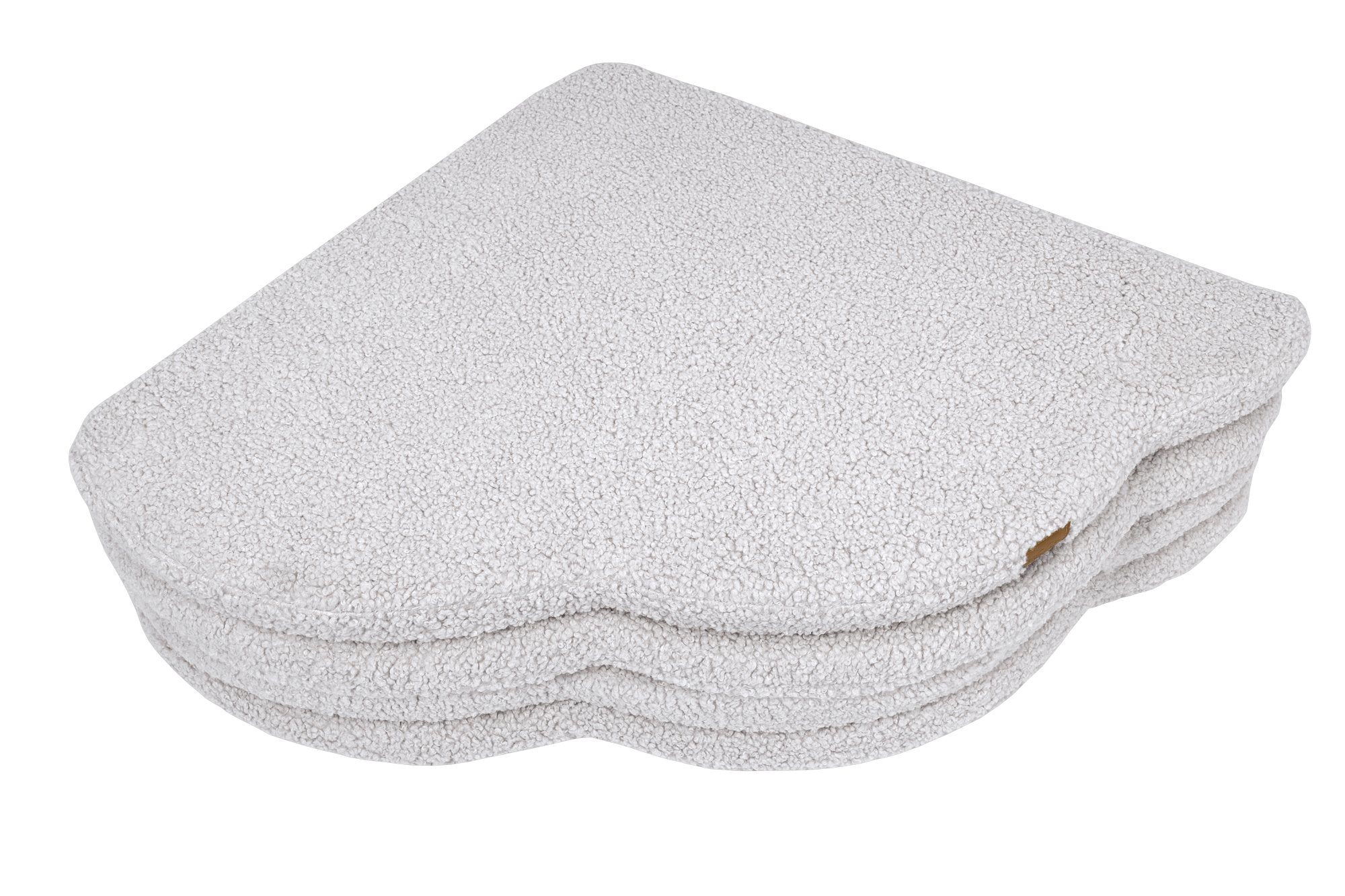 3. Close-up of folded cloud-shaped play mat in bearly white color, highlighting the textured surface and layered design, on a black background