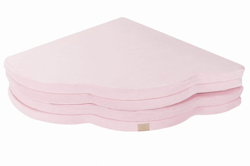 5. Folded pink cloud-shaped velvet play mat stacked on a white background