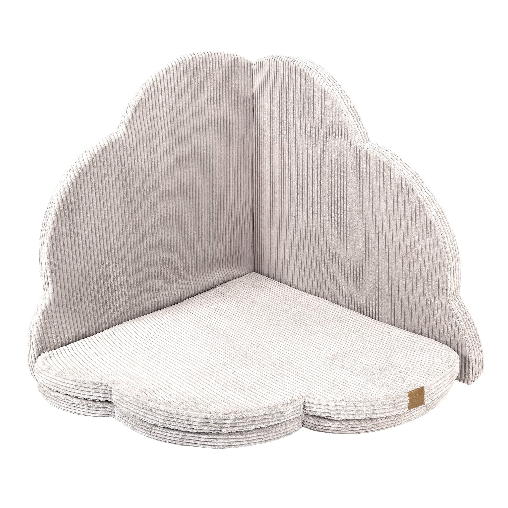 2. Cloud-shaped ecru play mat for kids with ribbed texture, shown upright in studio setting
