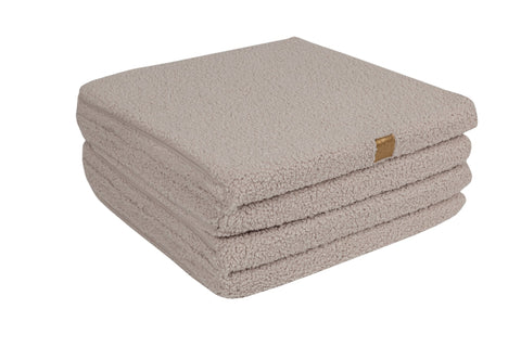 3. Folded square play mat in light grey with soft texture, displayed on black background