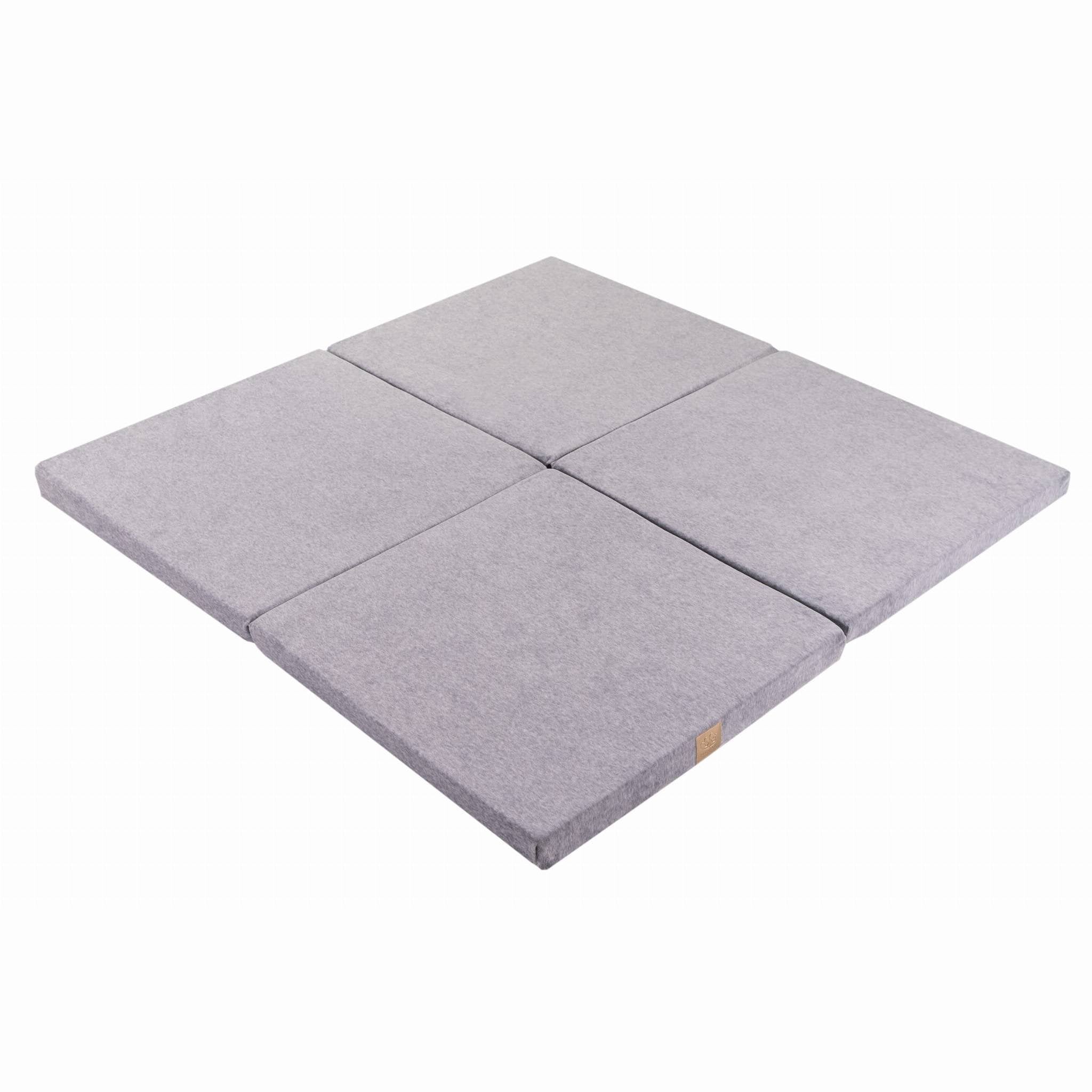 2. Square light grey velvet play mat folded in four sections on a white background