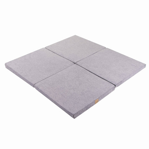2. Square light grey velvet play mat folded in four sections on a white background